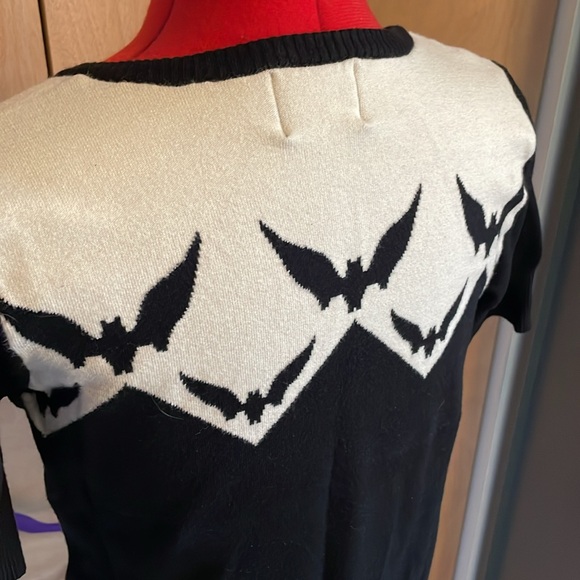Hell Bunny white and black knit top with bat details and black bow. - Picture 5 of 6